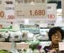 A woman looks at price tags of vegetables at a supermarket in Seoul April 26, 2011. Credit: Reuters/Truth Leem/Files