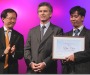 Bui Chat (extreme right) with his award, April 25, 2011.